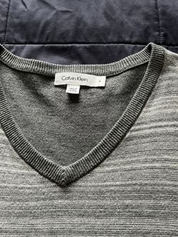 It’s Very Good Sweater Made By Calvin Klein. The Size Is Medium. The Color Is Gray It’s For Man’s 