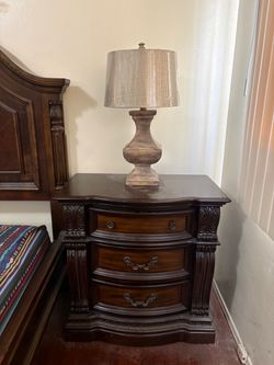 Dark Wood 3-Drawer Nightstand with Carved Detail