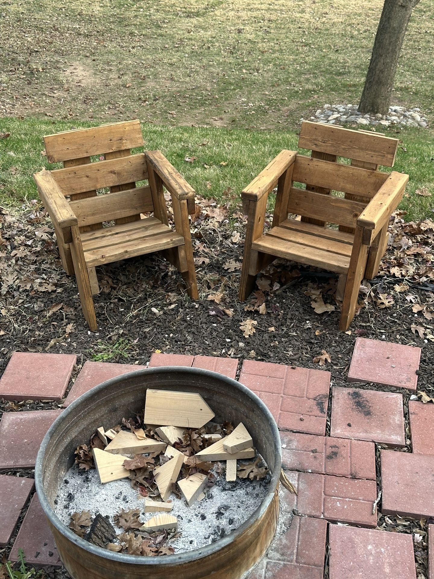 Upgrade your outdoor space with this beautiful handmade set of wooden chairs. Built from solid wood and finished with a rich mahogany stain, these cha