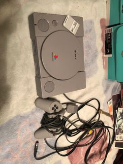 PlayStation 1 with controller and memory card