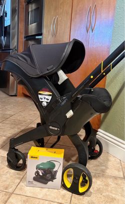 Doona Car Seat & Stroller: Midnight Edition + Accessories