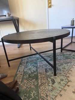 Circle solid metal crate and barrel coffee table