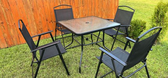 5-piece outdoor patio dining set eith glass top table and 4 folding chairs