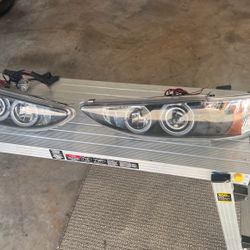 Brand New Headlight Assemblies, And Two Sets Of Brand New Circular Headlights