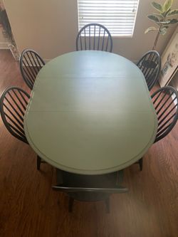 Beautiful solid wood dining table with 6 chairs. Stamped  Made in Canada.