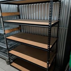 Large shelf. Metal with particle board shelving. $50 Holiday