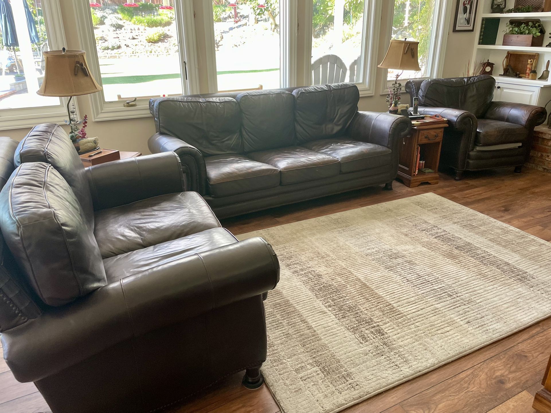 leather couch set . Couch, love seat and captains chair.