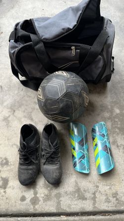 Soccer Cleats, Shin Guards, Ball, And Bag