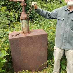 Antique Tank With Hand Pump