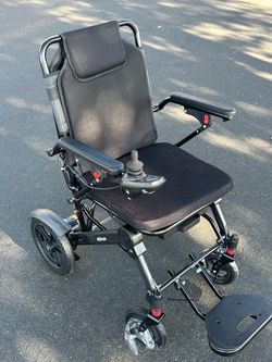 Brand new heavy duty electric wheelchair made out of graphite retails 1000