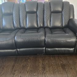 Black Three Seater Faux Leather Reclining Sofa