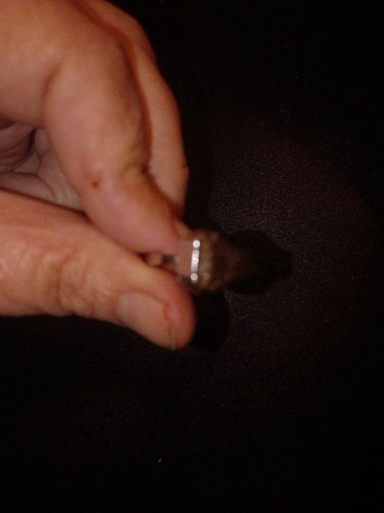 horseshoe nail bent into a ring,