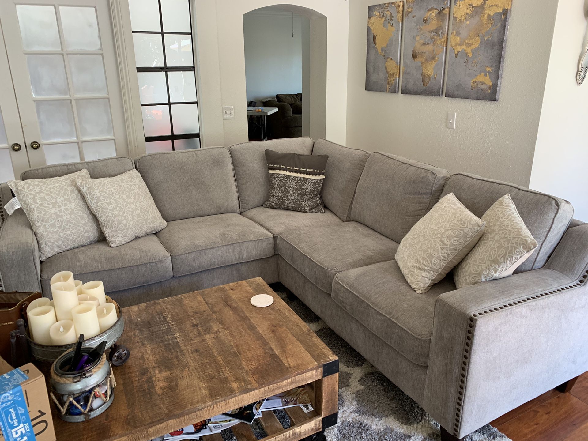 Costco sectional couch with nail-heads and pillows
