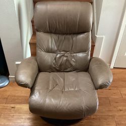 Swivel Rocking Chair Leather.( Brown.)  Dimensions are.  39” H— 35”W—-23”D.