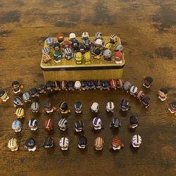 Teeny Mate Figures Along With Gold Characters And Players