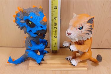 WowWee Fingerlings Untamed Radioactive Triceratops & Untamed Sabre Tooth Tiger
