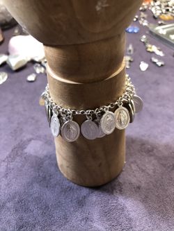 100 virgen charms .825 sterling Silver bracelet