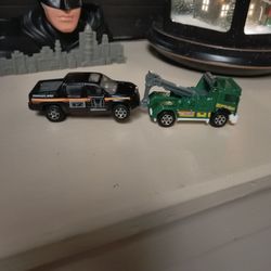 Green Tow Truck Hauling A 07 Ridgeline 