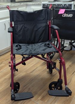 Transport Wheel Chair Folds Easily And Is Light Weight