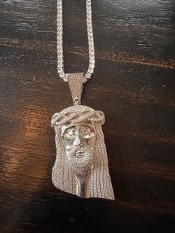 Tennis chain and Jesus piece