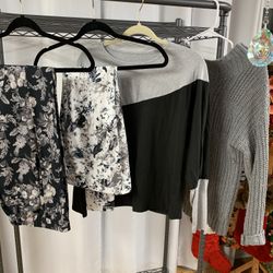 Grey Black And White Set Which Consist Of Black Print Jeans, White And Black Leggings, Black And Grey Top, And Grey Sweater