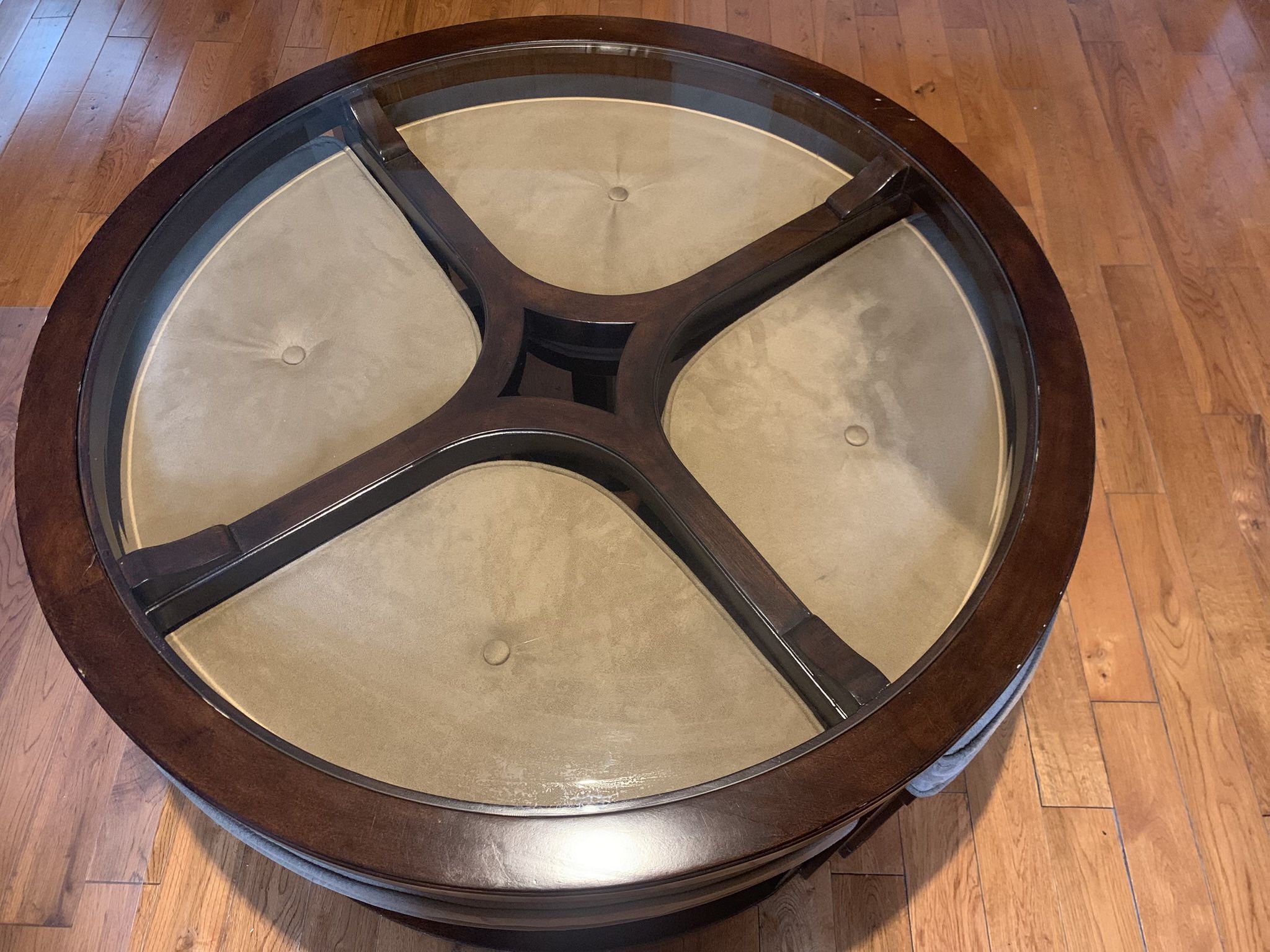 Coffee table with four hidden storage stools.