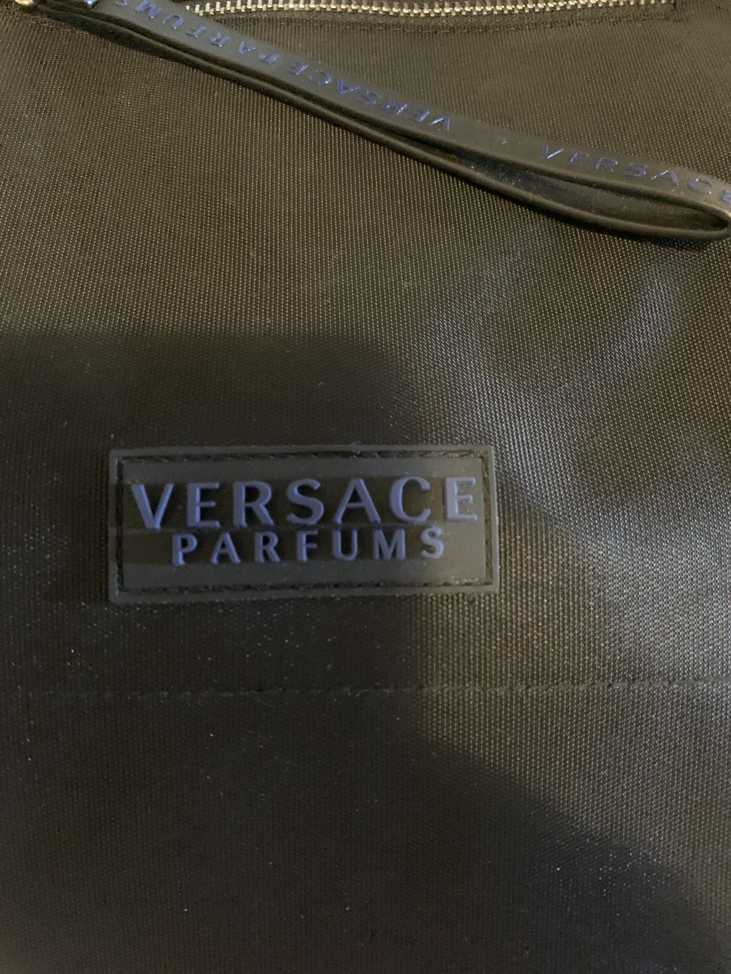 Versace big tote bag never used brand new still in the bag has the cloth bag and the shoulder strap