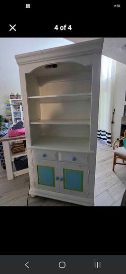 Two cabinets and a corner bookshelf