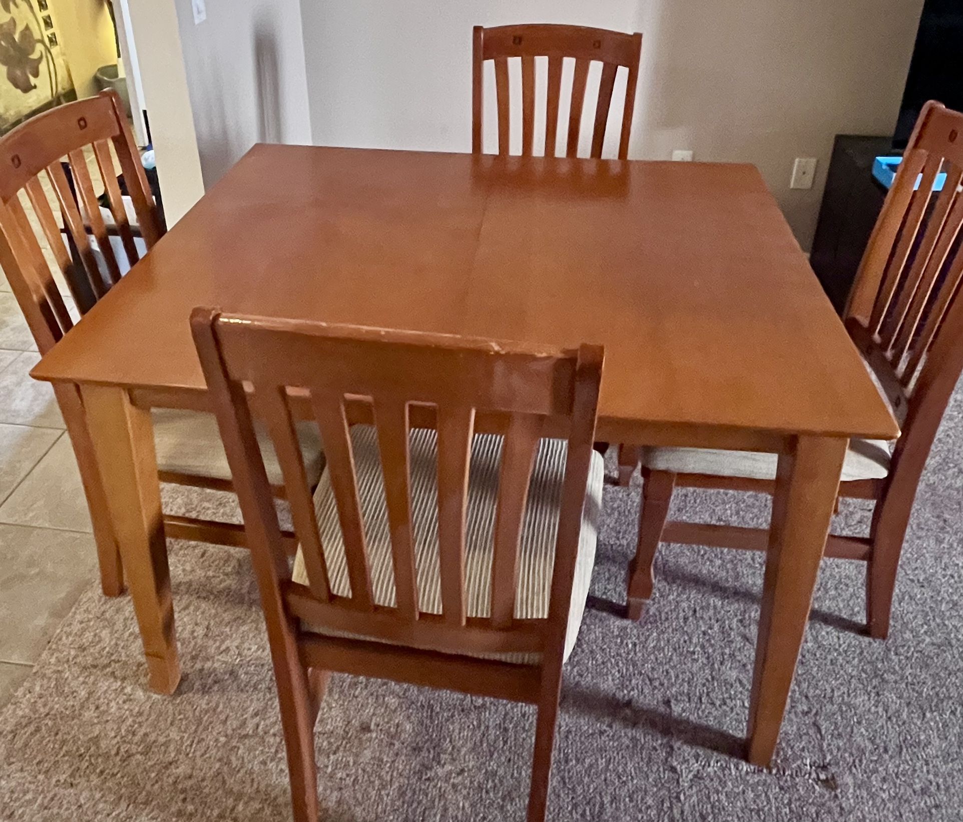 Wooden Table With Four Matching Chairs