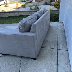 Gray couch with reversible chase