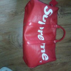 LOUIS VUITTON
X Supreme Epi Keepall Bandouliere 45 Red