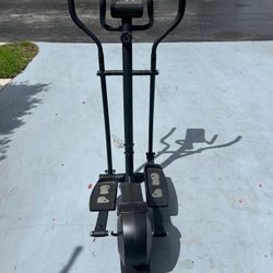 Exercising Elyptical Machine