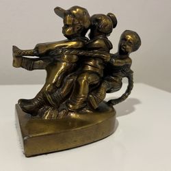 One Vintage PM Craftsman Bookend Brass Children “Tug Of War” Labeled Made In USA
