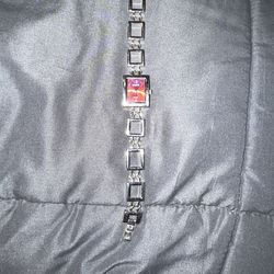 watch featuring a rectangular pink dial