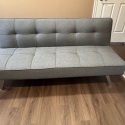 Grey fabric futon. 