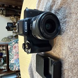 Canon EOS M50 24.1MP Mirrorless Camera - Black (Kit with 15-45mm STM Lens) - black with battery and charger. No memory card. Tested. Working great.