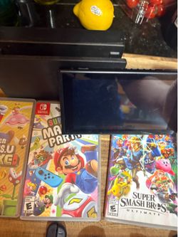Nintendo switch with extra controllers and controller tops with games