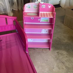 Mickey Mouse bed, bookshelf and a small table with two chairs