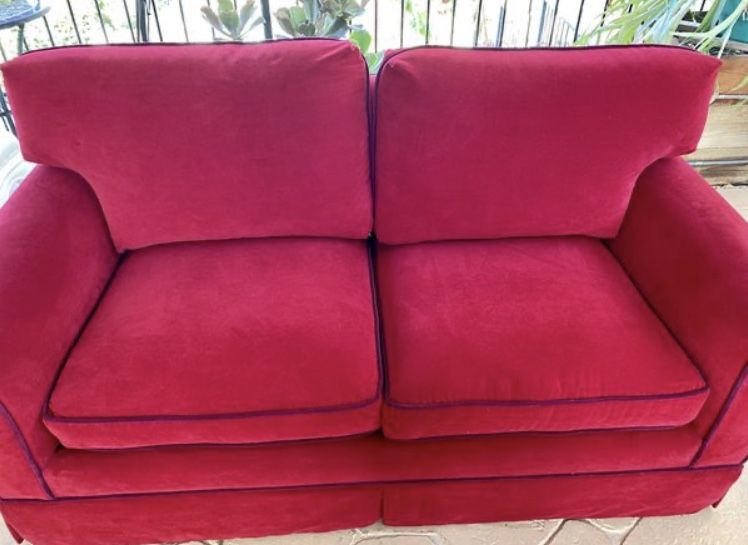 Very good condition red velvet couch. Free