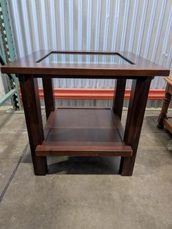 Versatile Dark Wood Accent Table with Glass Inlay and Lower Shelf