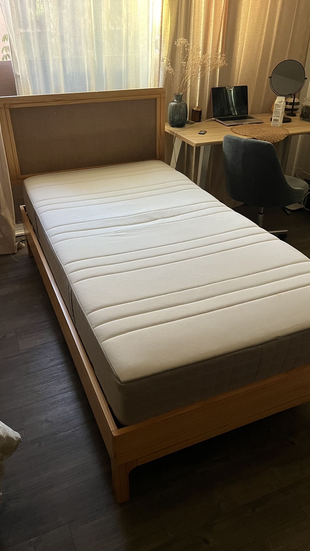 Twin wooden bed with Ikea mattress