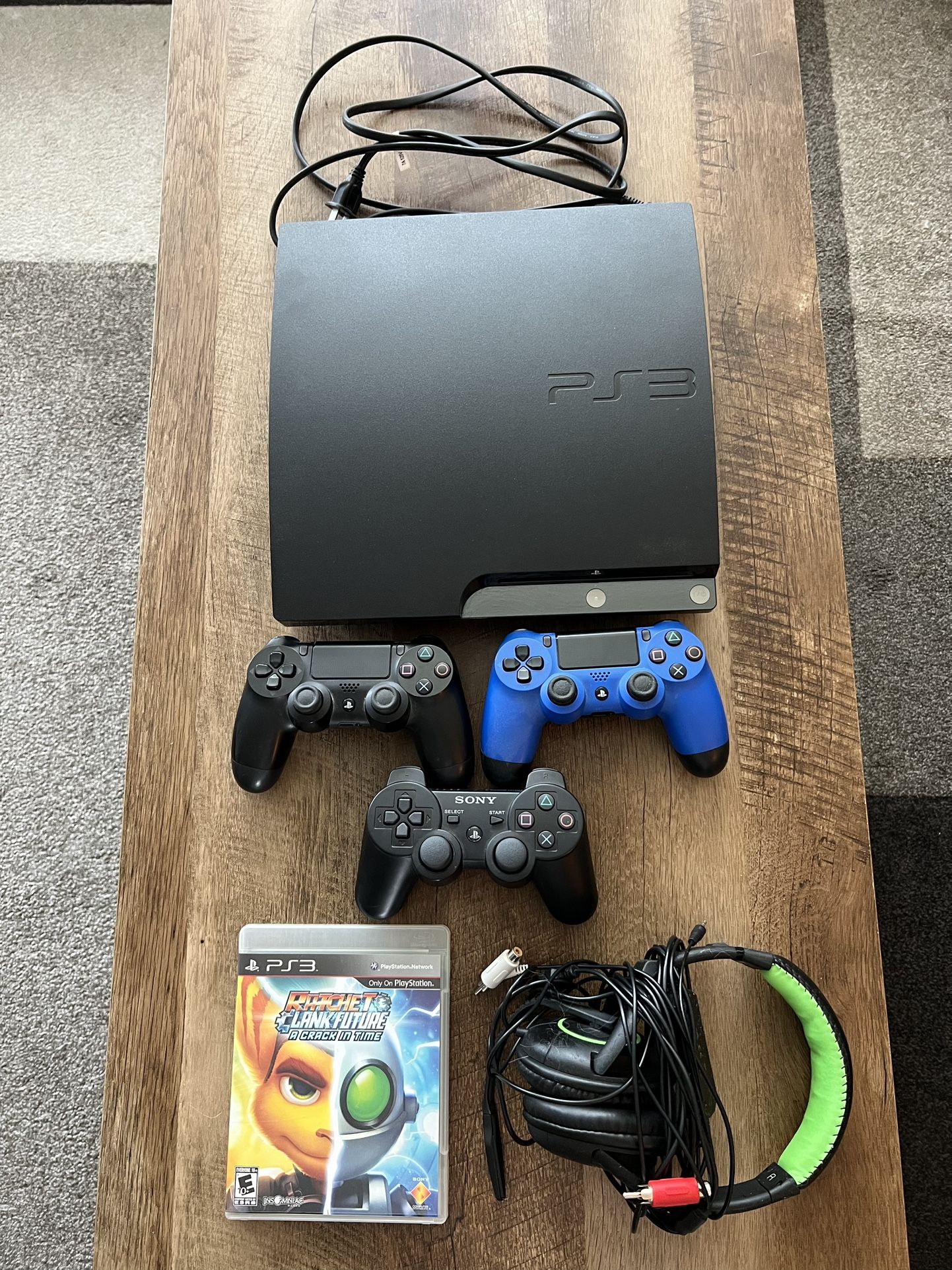 PS3 Slim Bundle – Works Great – Includes Controllers, Headset, & Game