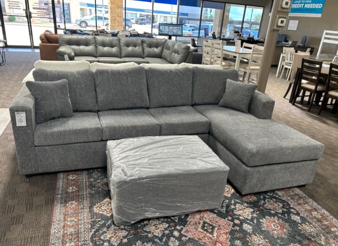 New Grey Sectional And Ottoman 