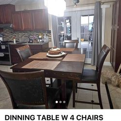 Dinning table and 4 chairs. Counter height Food condition, Delivery Available for a fee.