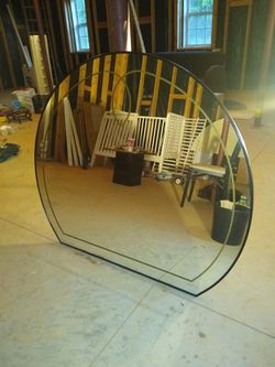Vintage mirror with black frame made in Italy in excellent condition except some of the gold trim is missing