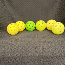 Six Pickle Balls For 25 Dollars