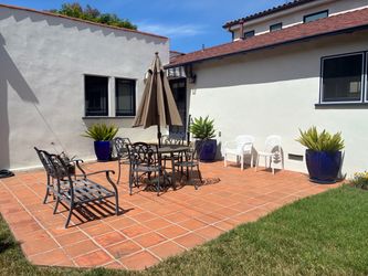 Patio table set, It includes the table with 4 chairs, bench, & umbrella with base. pick up in Santa Monica.