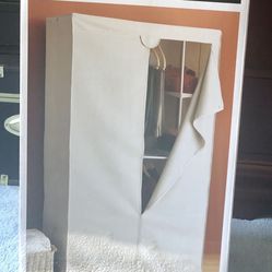 Covered, portable wardrobe/closet