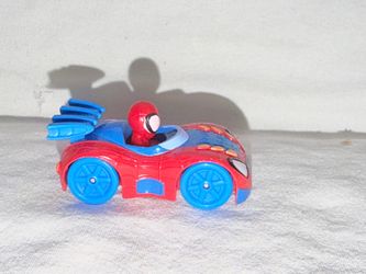Spider-Man Toy Race Car Figure it’s on my hand. Please note it’s hand size. Like hot wheels.