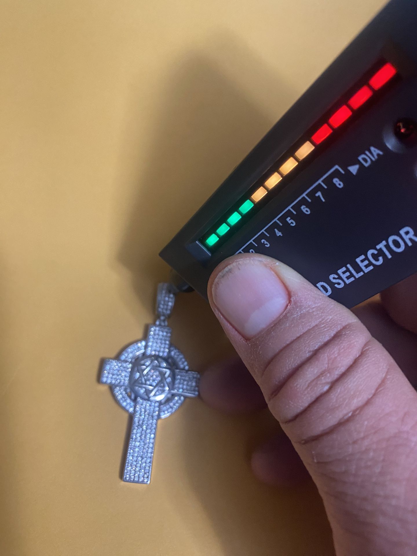 Semi-new silver cross with real diamonds featuring the Star of David, asking for $250 firm price, cash only.